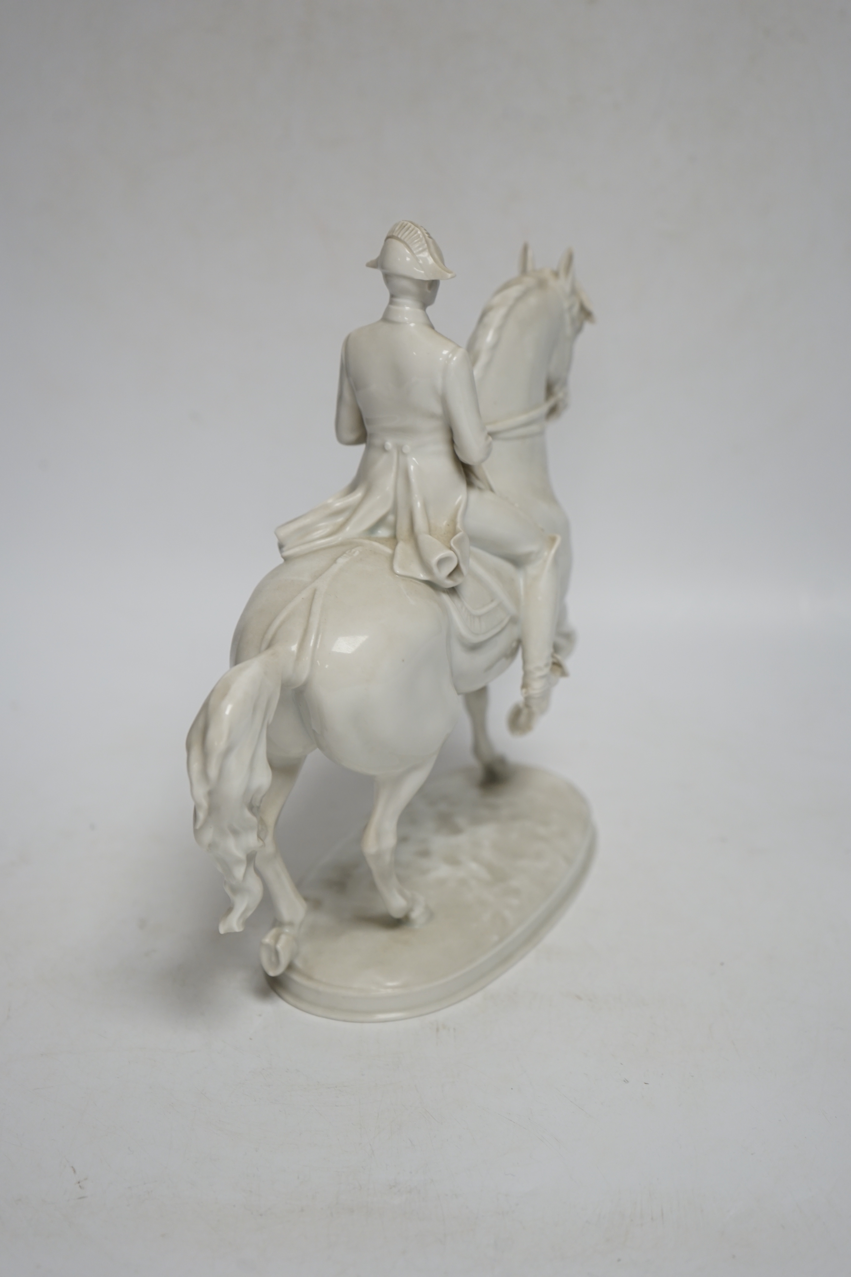 An Augarten, Wien white glazed porcelain Spanish Riding School Group, 24cm